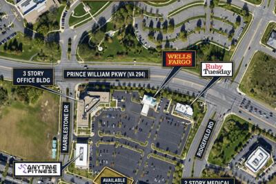 The vacant pad site at 12741 Marblestone Drive, Woodbridge, seen from the parking lot.
